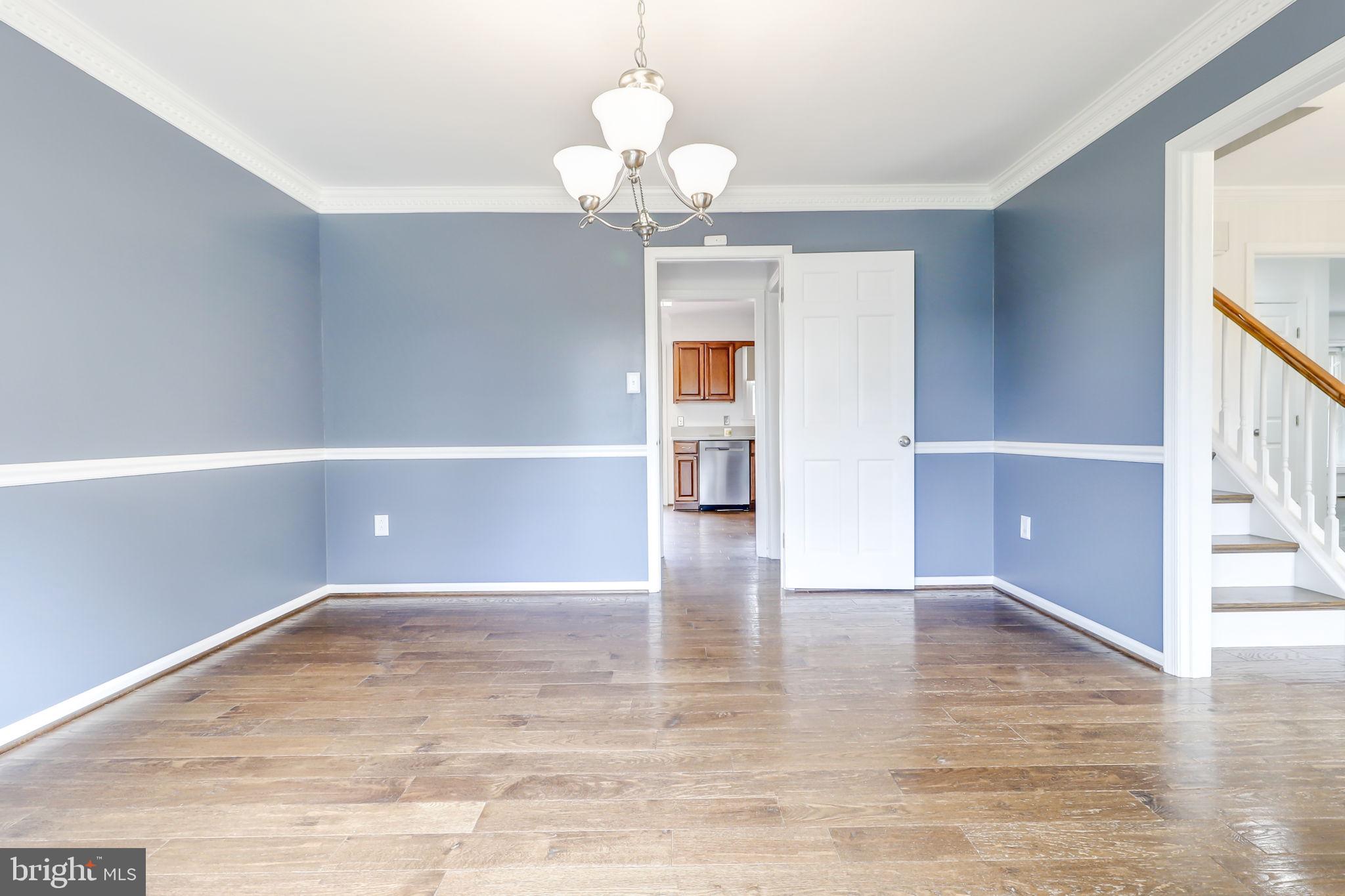 21960 Oatlands Road Aldie, VA 20105 - Photo 35 of 79 a view of an empty room with wooden floor and a window