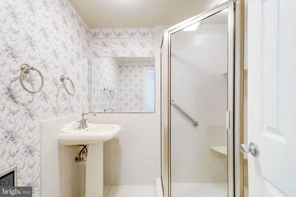 a view of hallway with wooden floor