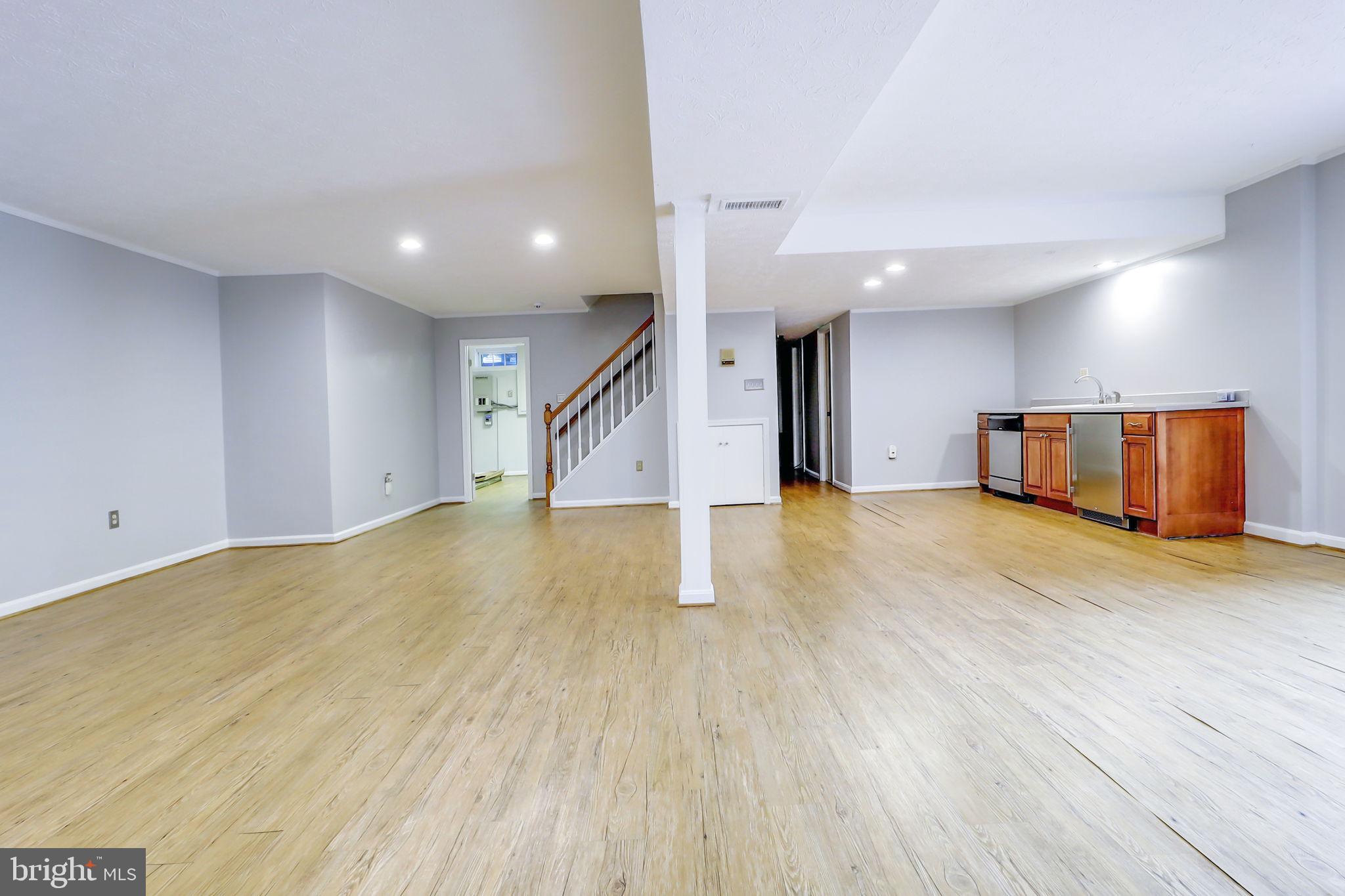 21960 Oatlands Road Aldie, VA 20105 - Photo 50 of 79 a view of an empty room with wooden floor