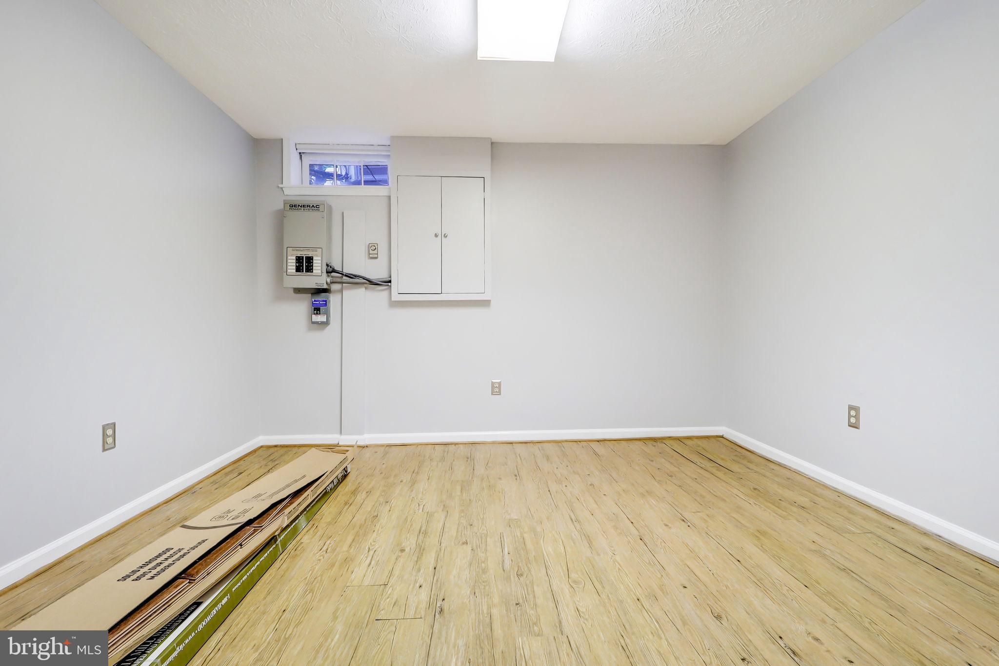 21960 Oatlands Road Aldie, VA 20105 - Photo 56 of 79 a view of a room with wooden floor and cabinet