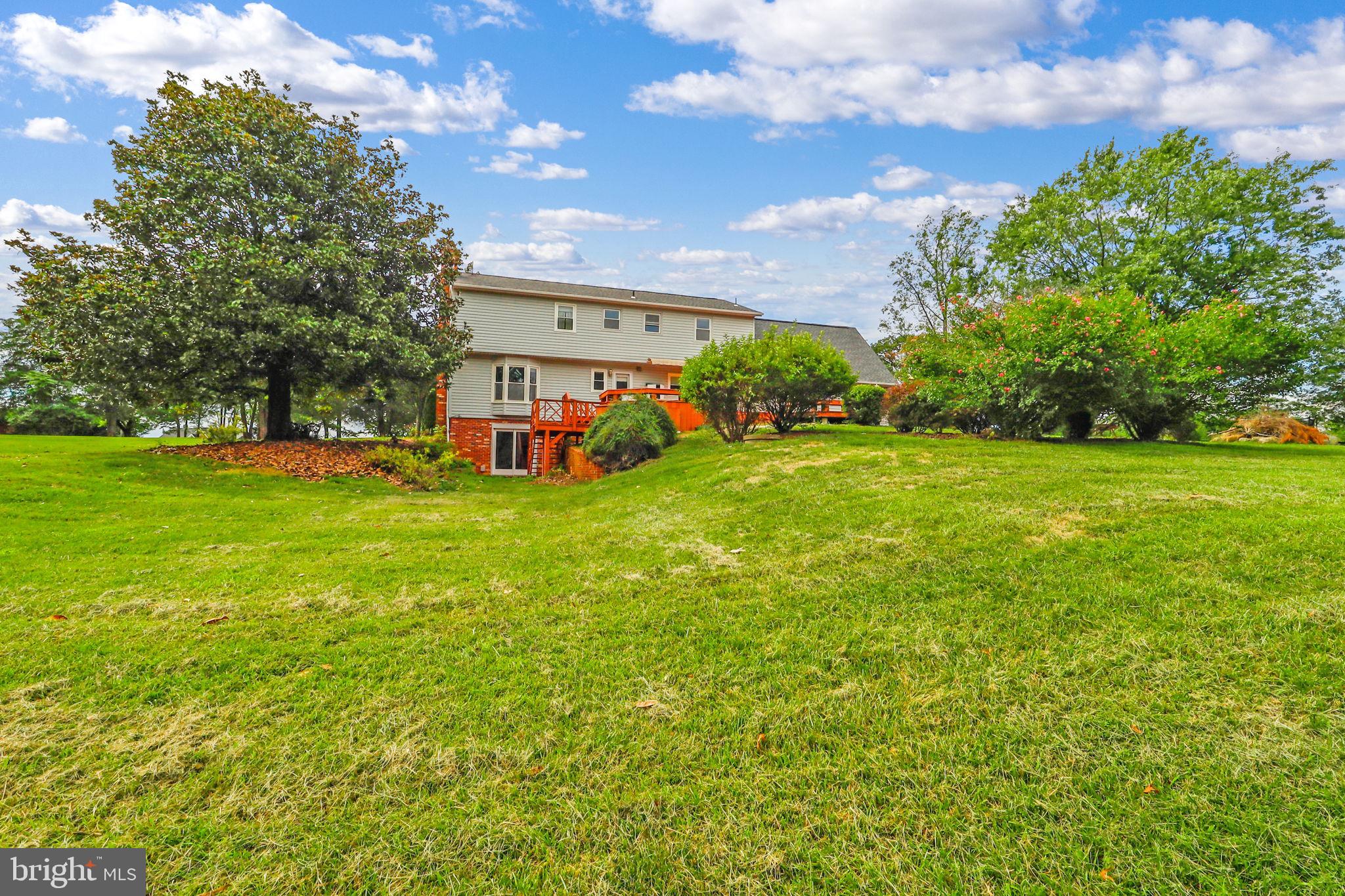 21960 Oatlands Road Aldie, VA 20105 - Photo 6 of 79 a view of a house with a big yard and large trees