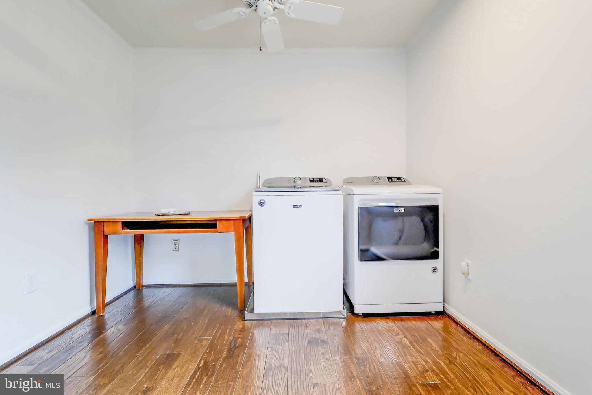 21960 Oatlands Road Aldie, VA 20105 - Photo 62 of 79 a utility room with wooden floor washer and dryer