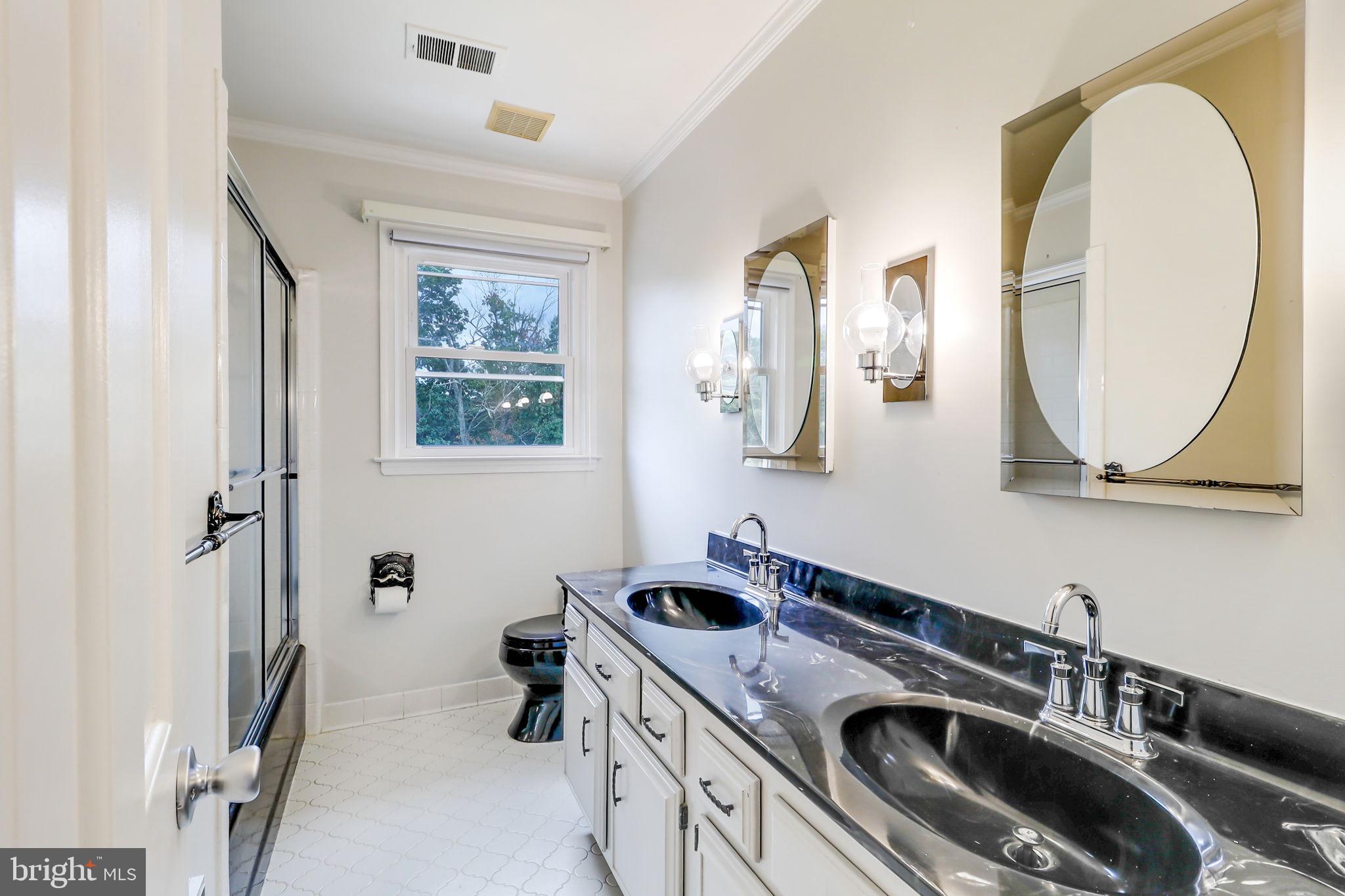 21960 Oatlands Road Aldie, VA 20105 - Photo 66 of 79 a kitchen that has a sink and a stove