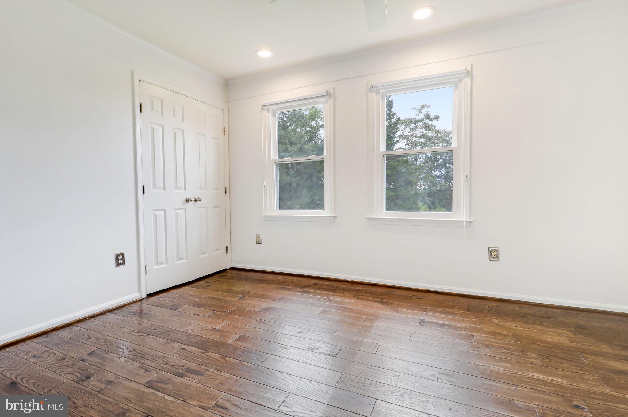 21960 Oatlands Road Aldie, VA 20105 - Photo 67 of 79 an empty room with wooden floor and windows