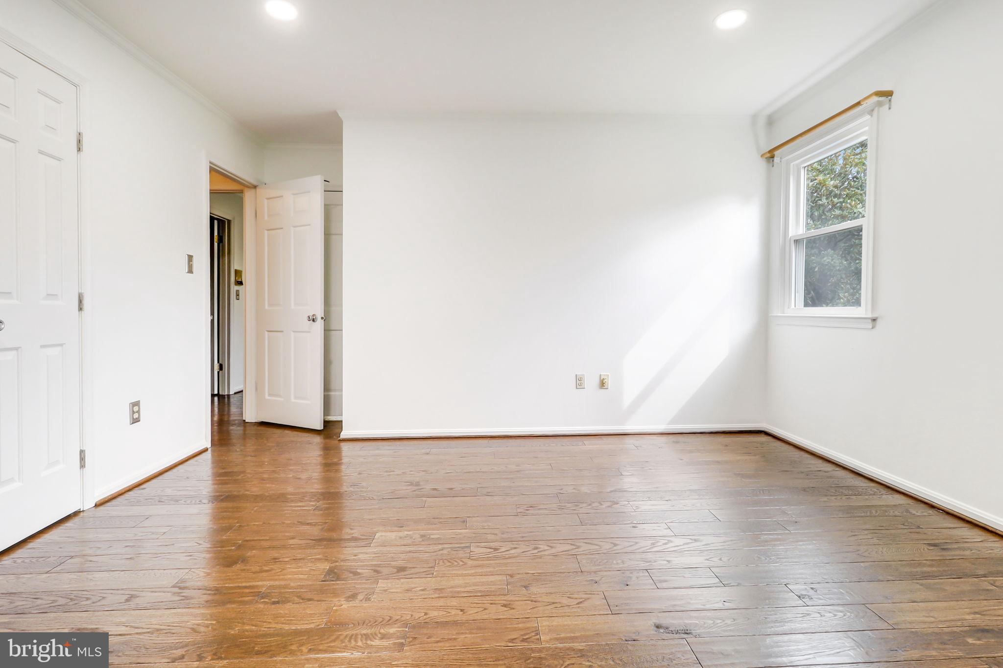 21960 Oatlands Road Aldie, VA 20105 - Photo 68 of 79 an empty room with wooden floor and windows