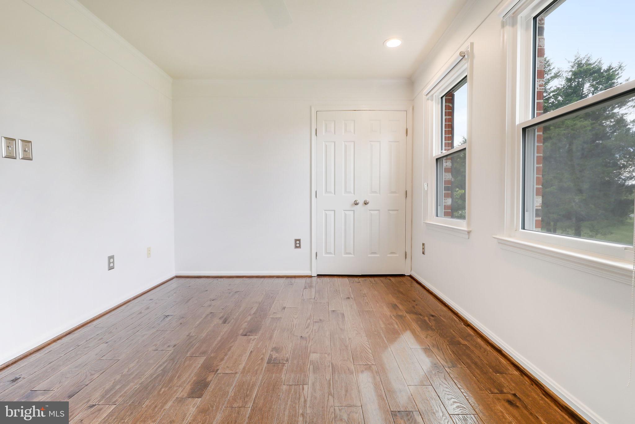 21960 Oatlands Road Aldie, VA 20105 - Photo 69 of 79 a view of an empty room with wooden floor and a window