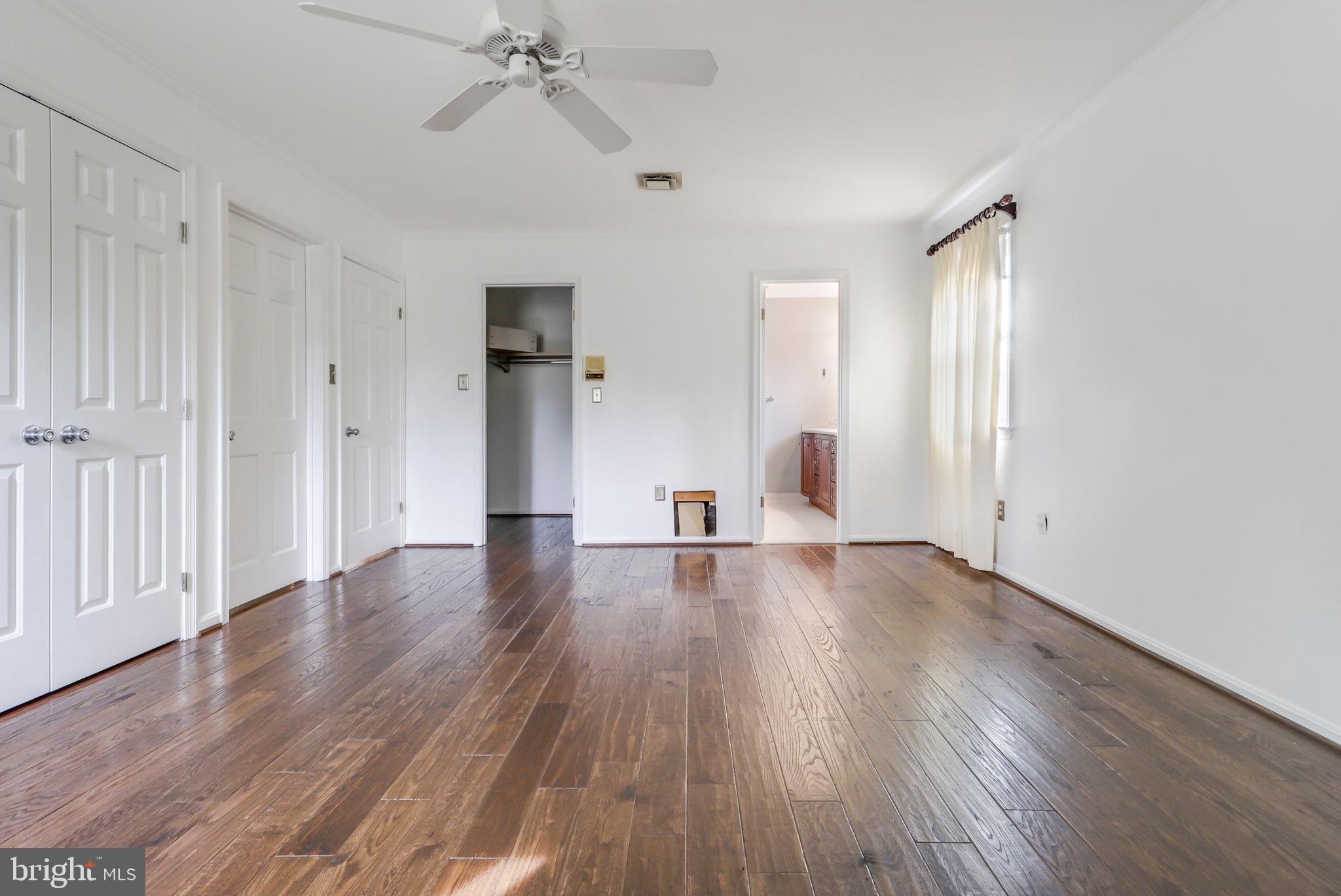 21960 Oatlands Road Aldie, VA 20105 - Photo 73 of 79 a view of empty room with wooden floor and fan