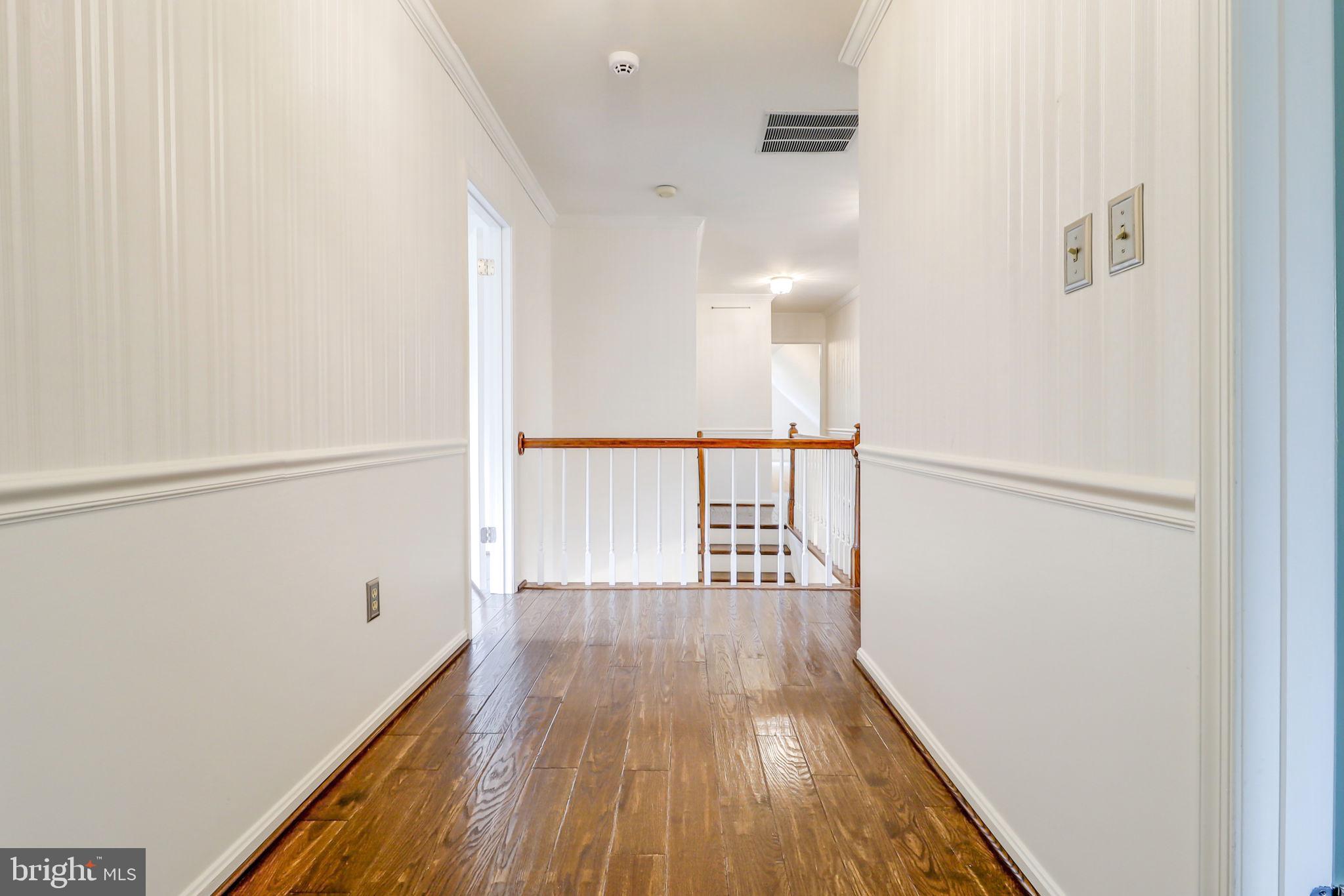 21960 Oatlands Road Aldie, VA 20105 - Photo 78 of 79 a view of hallway with wooden floor