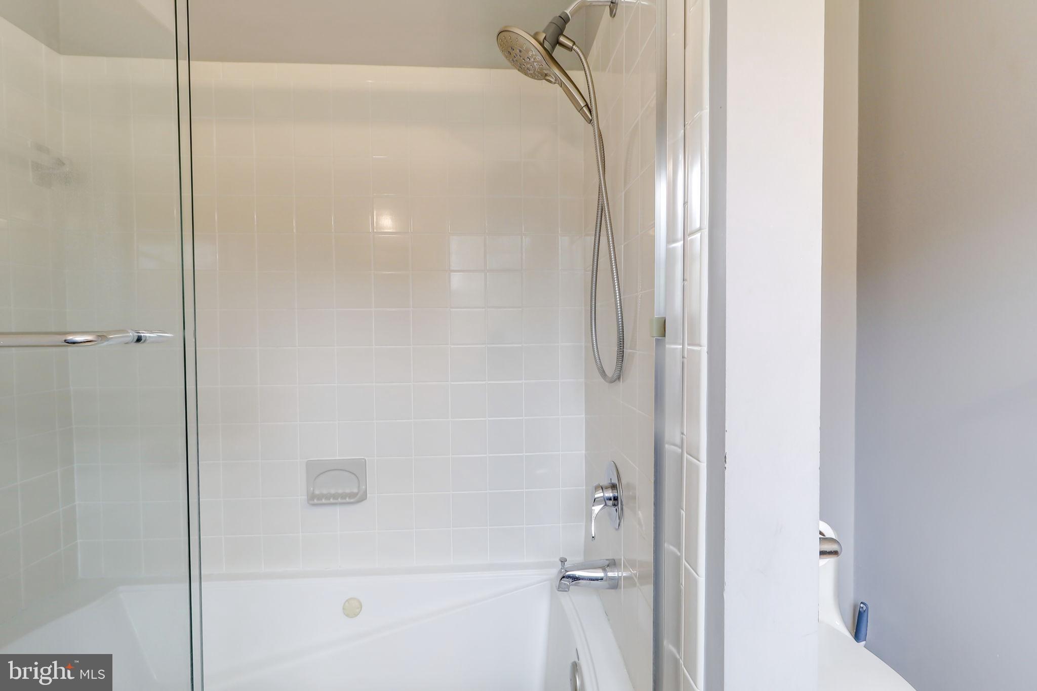21960 Oatlands Road Aldie, VA 20105 - Photo 79 of 79 a bathroom with a glass shower door