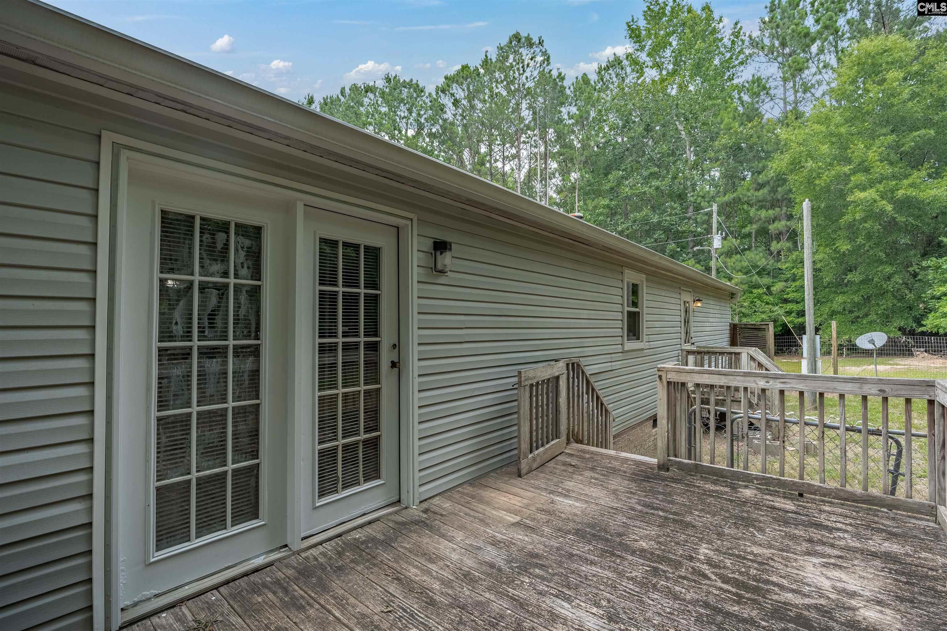304 Cooper Road Blythewood, SC 29016 - Photo 25 of 29 a view of house with a deck and furniture
