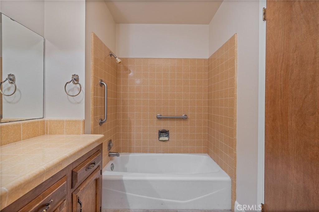 32413 Chickasaw Road Coarsegold, CA 93614 - Photo 11 of 66 a bathroom with a bathtub and a sink