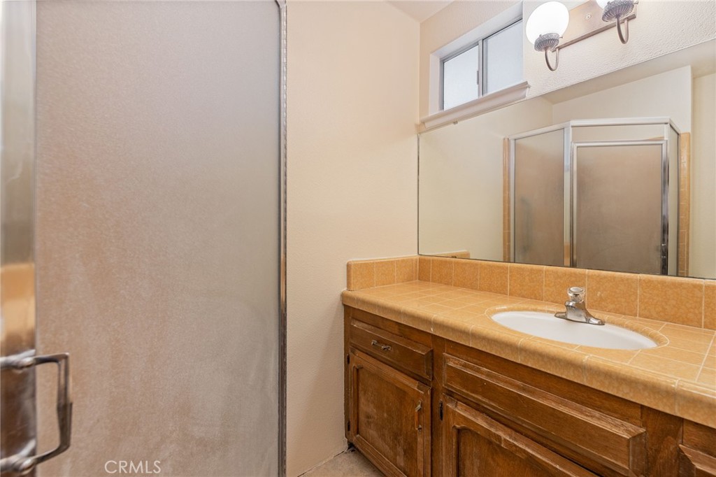 32413 Chickasaw Road Coarsegold, CA 93614 - Photo 12 of 66 a bathroom with a sink and a mirror