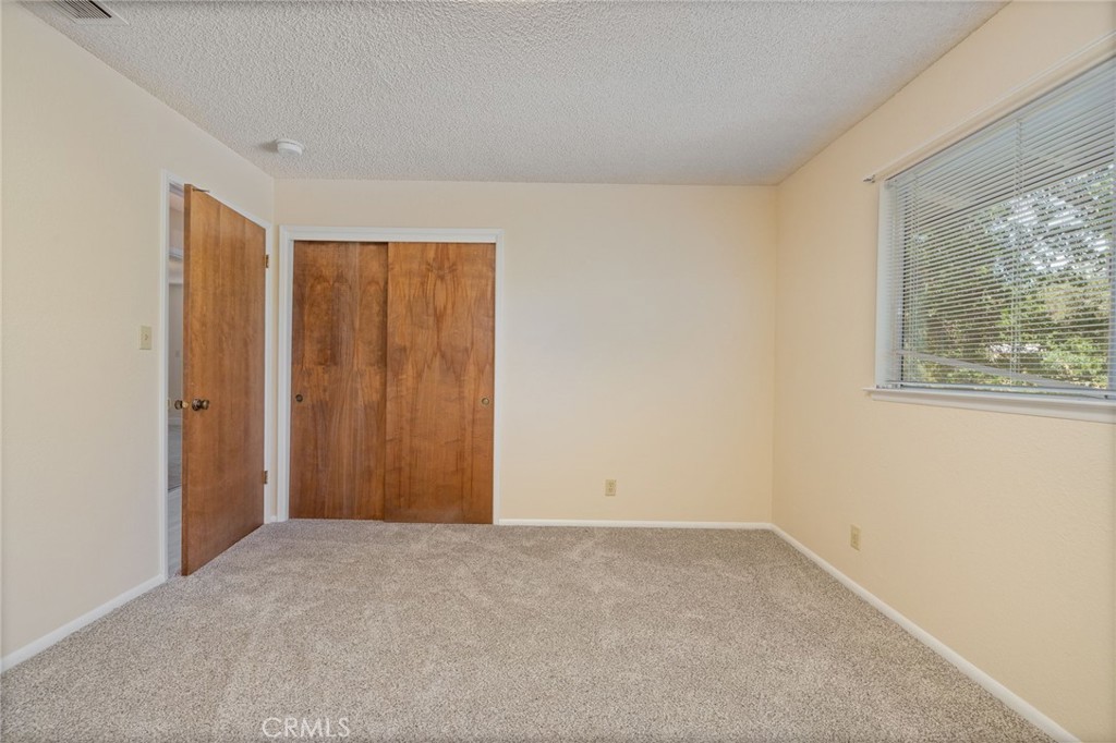 32413 Chickasaw Road Coarsegold, CA 93614 - Photo 26 of 66 a view of an empty room with a window