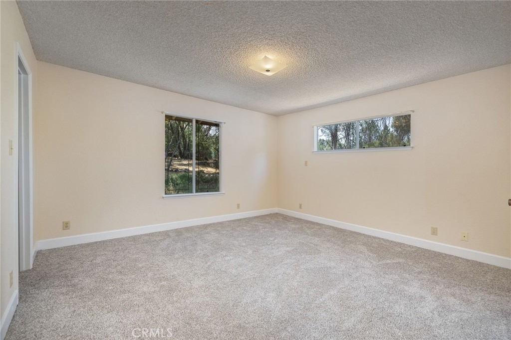 32413 Chickasaw Road Coarsegold, CA 93614 - Photo 31 of 66 an empty room with windows