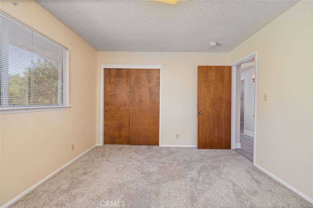 32413 Chickasaw Road Coarsegold, CA 93614 - Photo 32 of 66 a view of an empty room and a window