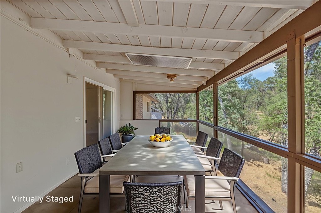 32413 Chickasaw Road Coarsegold, CA 93614 - Photo 8 of 66 a view of a dining room with furniture window and outside view