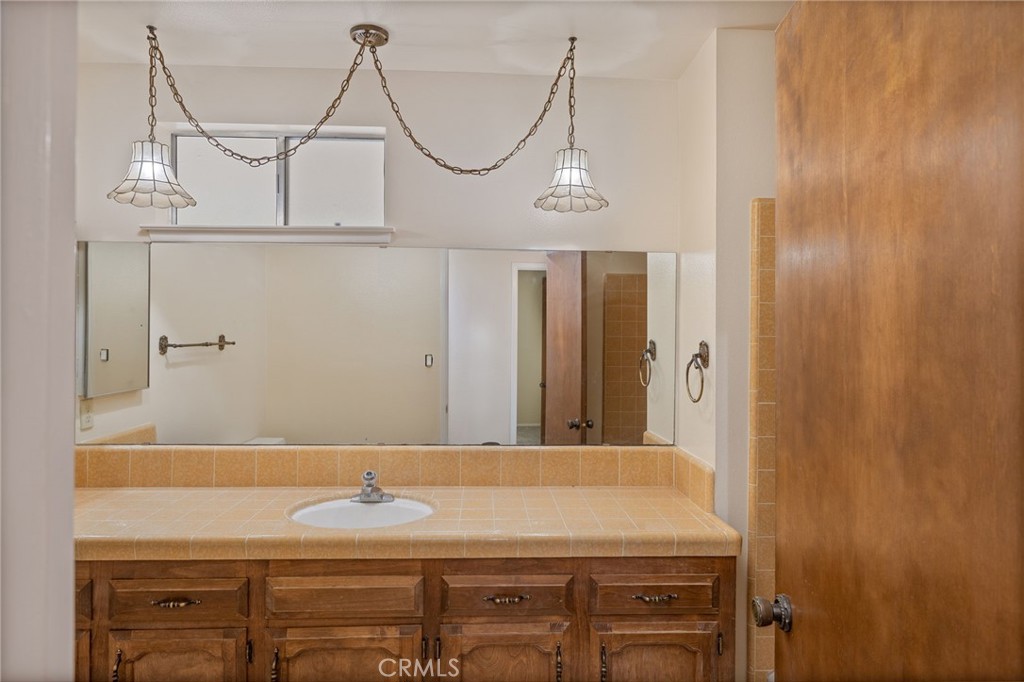 32413 Chickasaw Road Coarsegold, CA 93614 - Photo 10 of 66 a bathroom with a sink and a mirror