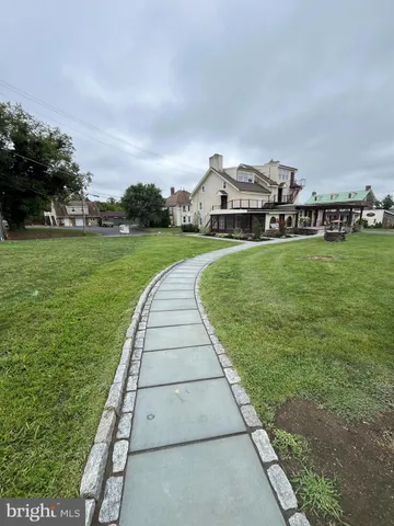 a view of a garden with houses