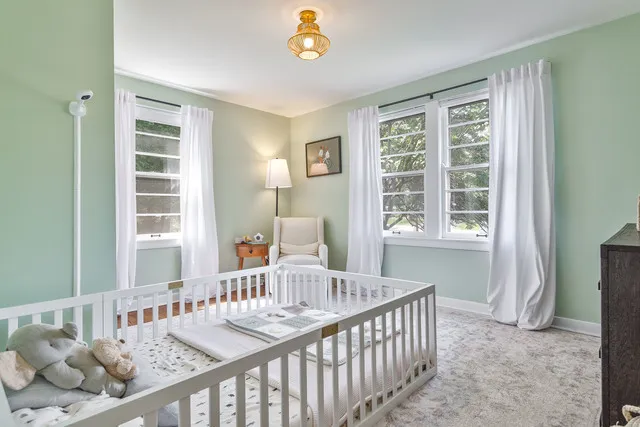 a bedroom with furniture and a window