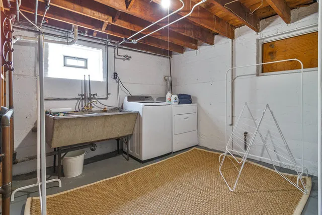 a room with exposed pipes and a table