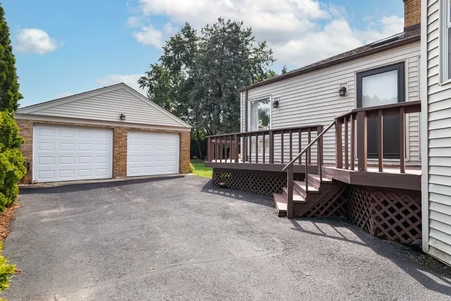 a view of backyard and deck