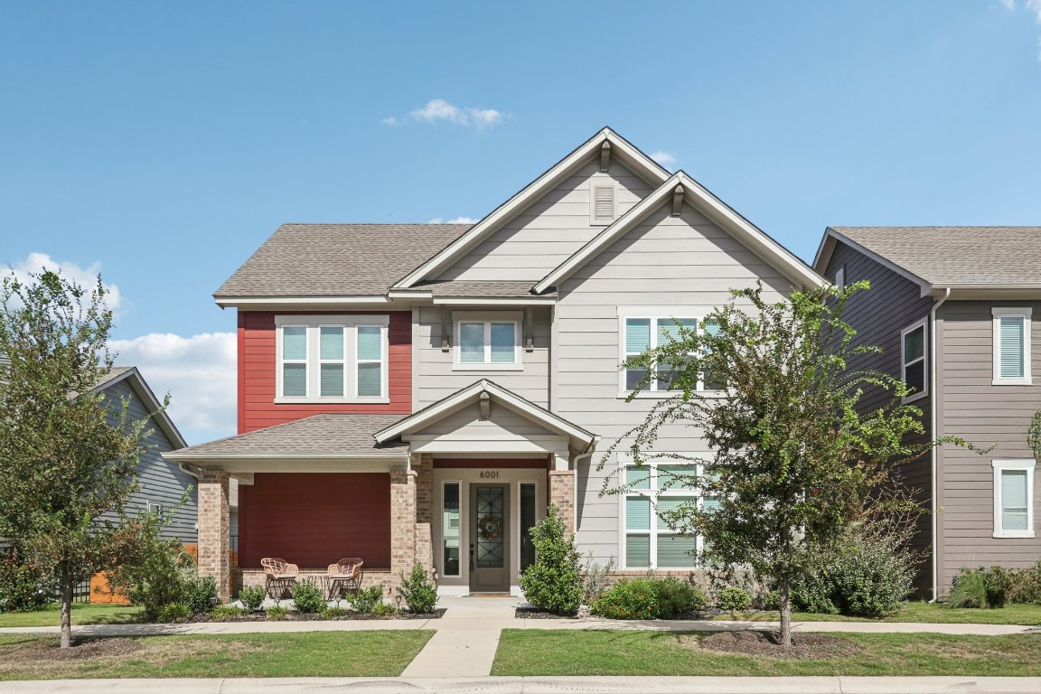 6001 McMurtry Street Austin, TX 78747 - Photo 1 of 26 a front view of a house with a yard