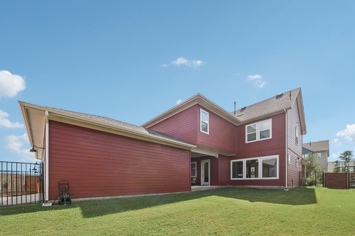 6001 McMurtry Street Austin, TX 78747 - Photo 19 of 26 a view of a brick house with a yard
