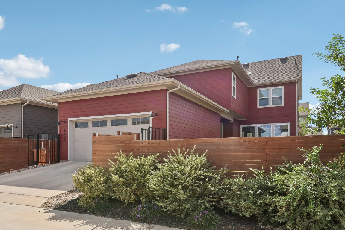 6001 McMurtry Street Austin, TX 78747 - Photo 20 of 26 front view of house with a yard