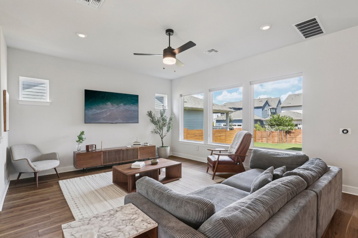6001 McMurtry Street Austin, TX 78747 - Photo 2 of 26 a living room with furniture and a flat screen tv