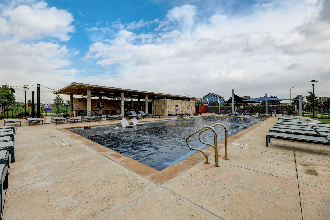 6001 McMurtry Street Austin, TX 78747 - Photo 24 of 26 a view of a tennis ground with large trees