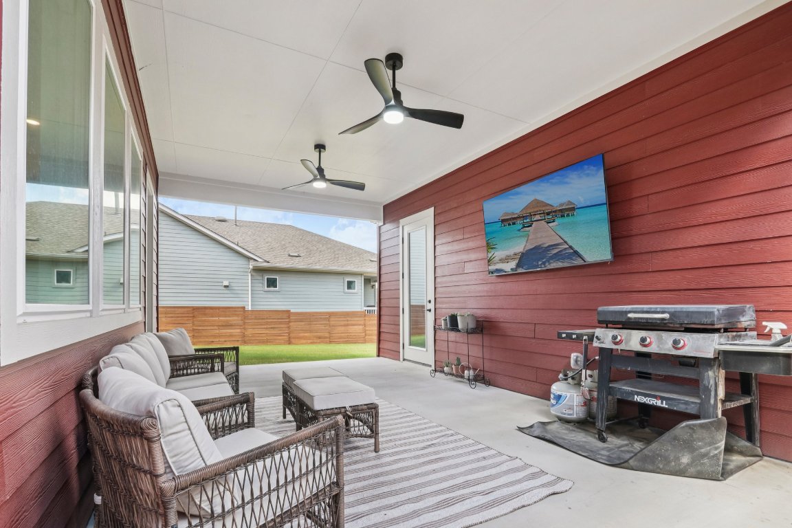 6001 McMurtry Street Austin, TX 78747 - Photo 3 of 26 a living room with furniture and a flat screen tv