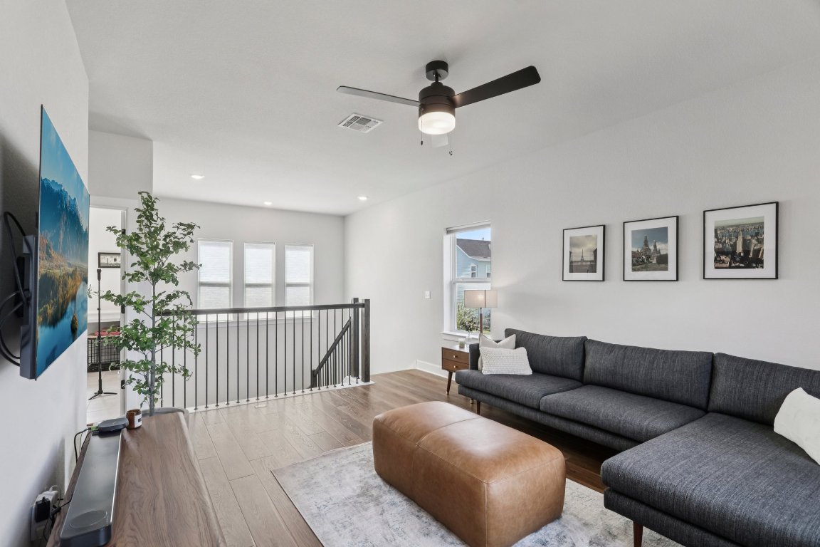 6001 McMurtry Street Austin, TX 78747 - Photo 10 of 26 a living room with furniture and a flat screen tv