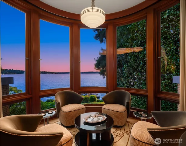 a kitchen with stainless steel appliances granite countertop a sink a stove and a wooden floors