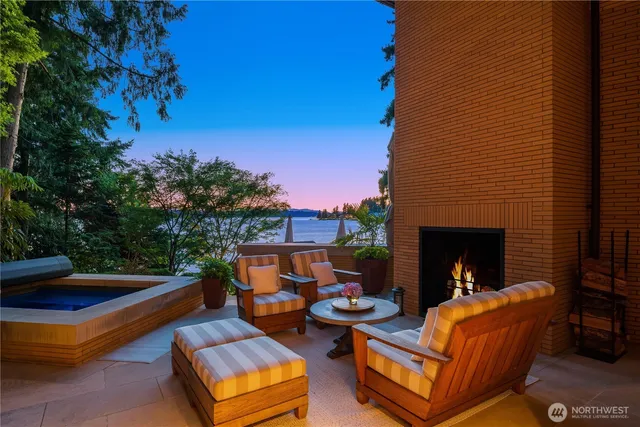 a view of a patio with a table and chairs under an umbrella