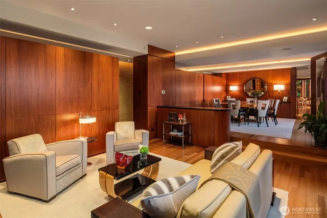 a living room with a large window and a table