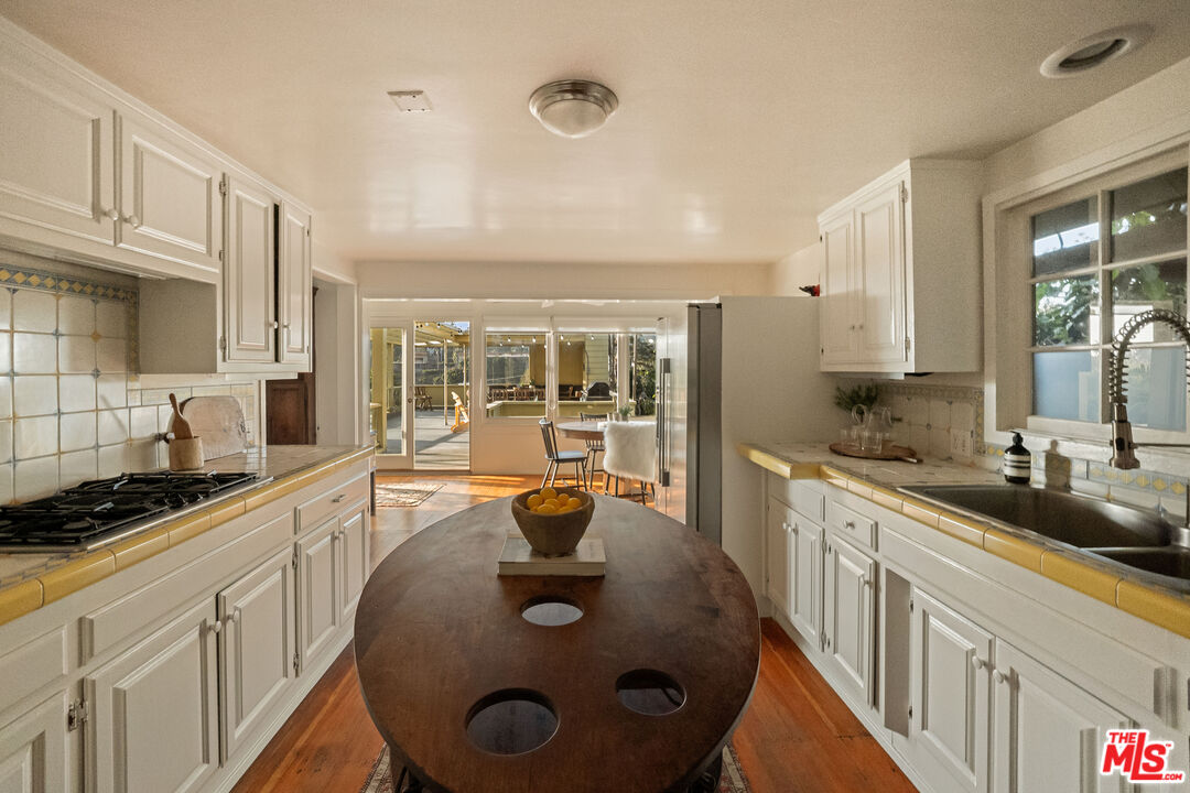 237 Mabery Road Santa Monica, CA 90402 - Photo 11 of 43 a kitchen with a sink stove and cabinets