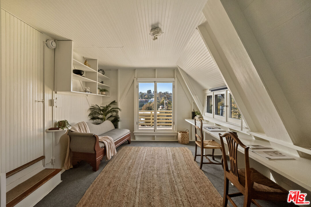 237 Mabery Road Santa Monica, CA 90402 - Photo 25 of 43 a living room with furniture a rug and white walls