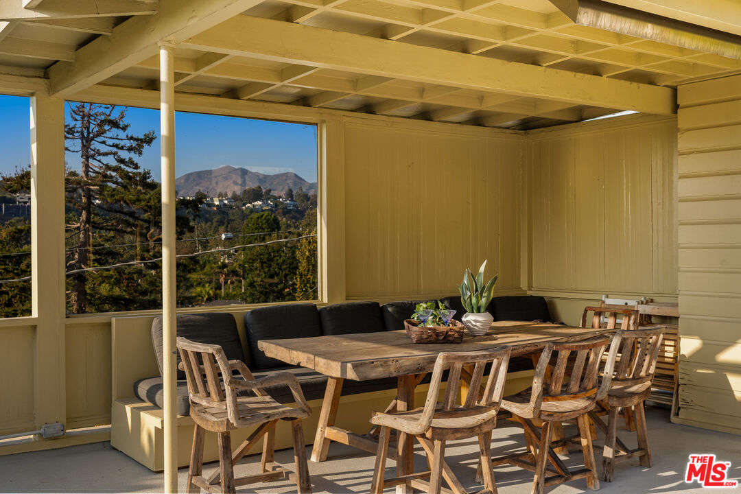 237 Mabery Road Santa Monica, CA 90402 - Photo 9 of 43 a table and chairs in front of a glass door