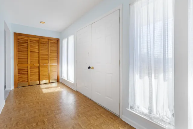 a view of an empty room with a window