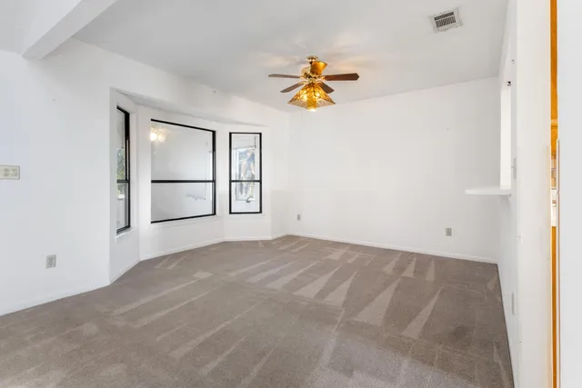 a bathroom with a double vanity sink and a window