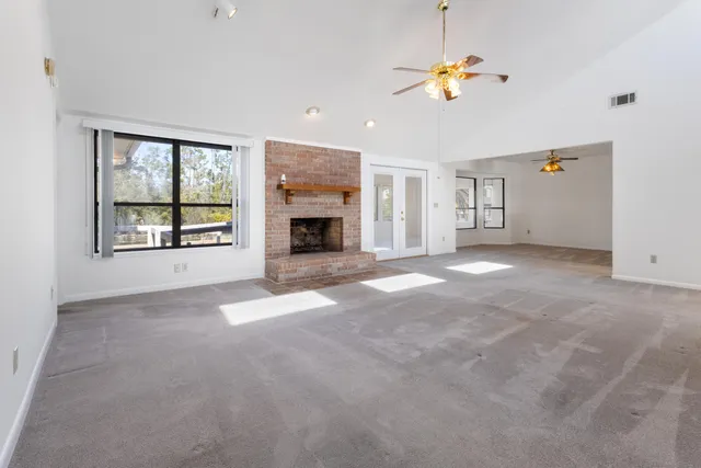 a view of empty room with windows