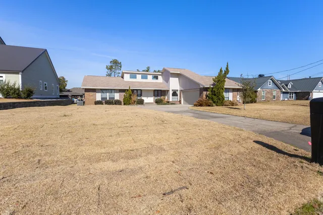 a house view with a garden space