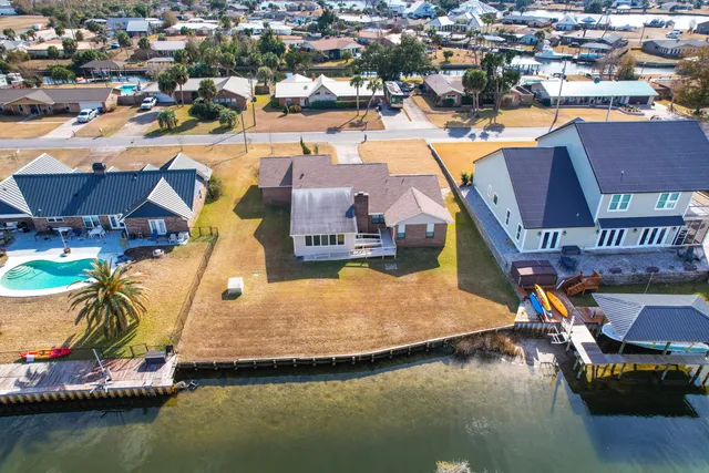 an aerial view of a house with a swimming pool