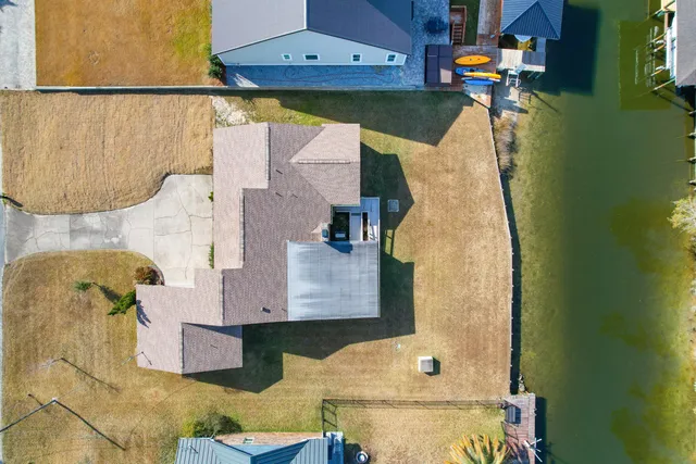 an aerial view of residential houses with outdoor space