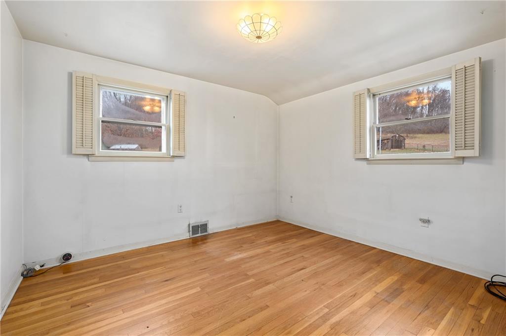 116 Harry Long Road Greensburg, PA 15601 - Photo 17 of 24 a view of empty room with wooden floor