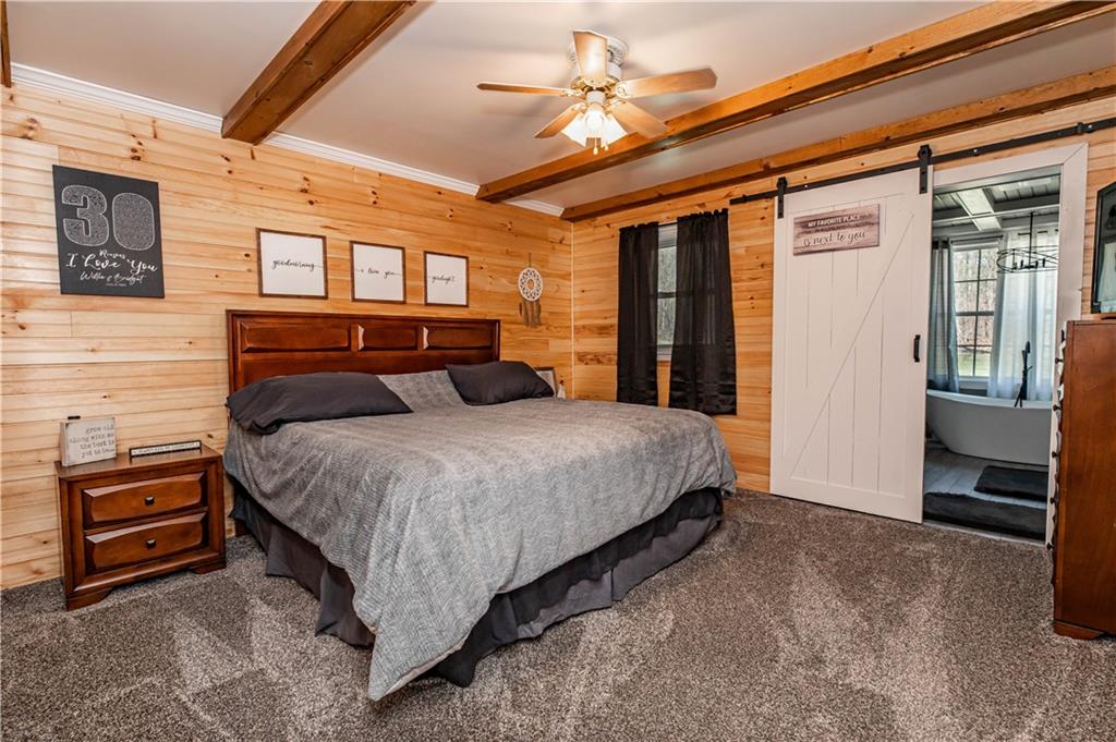 280 Chestnut Road Penn Run, PA 15765 - Photo 15 of 25 a bedroom with a bed and a ceiling fan