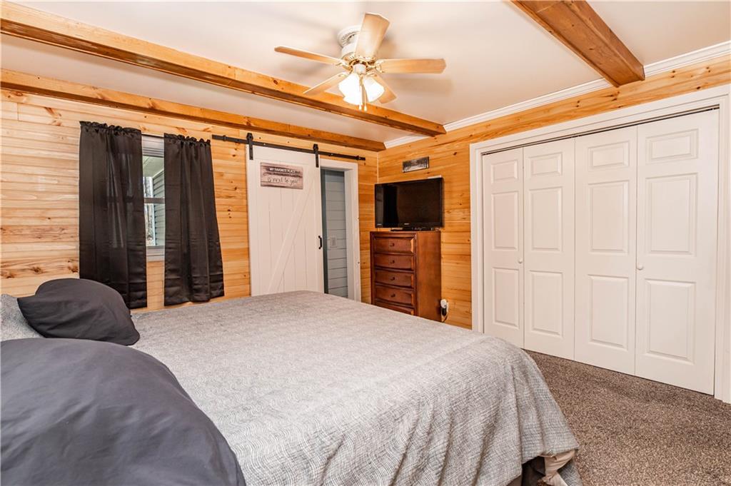 280 Chestnut Road Penn Run, PA 15765 - Photo 16 of 25 a bedroom with a bed and a chandelier