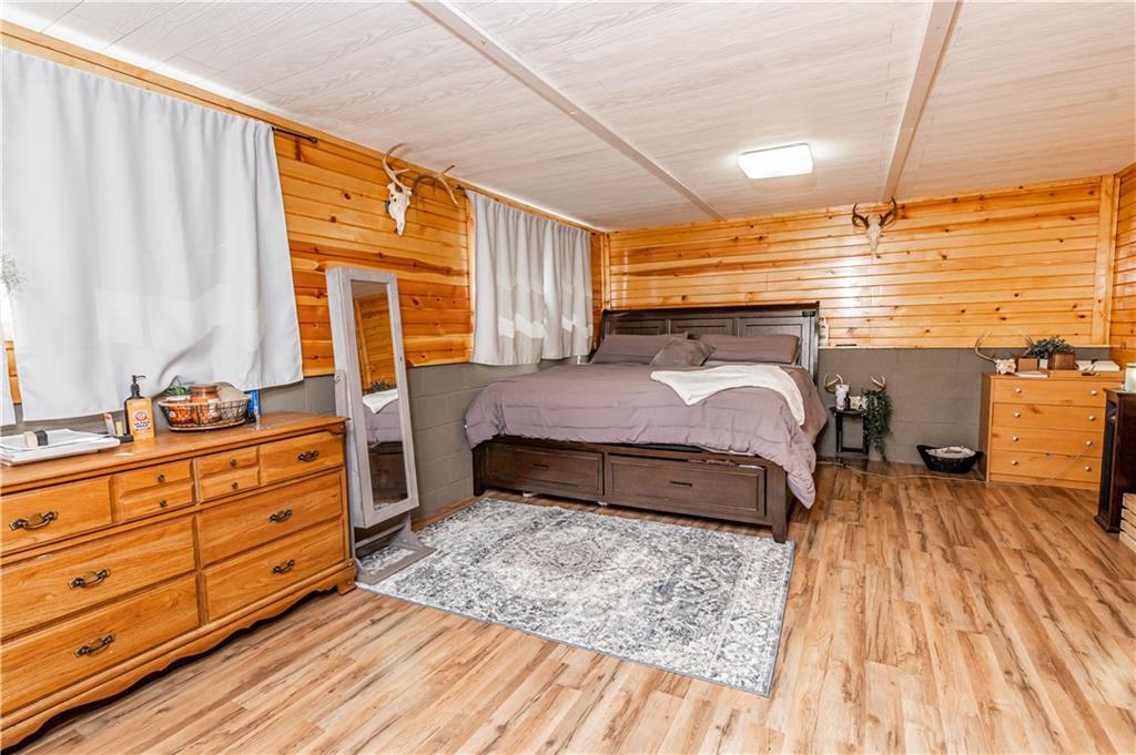 280 Chestnut Road Penn Run, PA 15765 - Photo 19 of 25 a bedroom with a bed and wooden floor