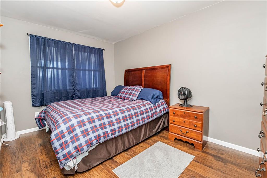 280 Chestnut Road Penn Run, PA 15765 - Photo 21 of 25 a bedroom with a bed and wooden floor
