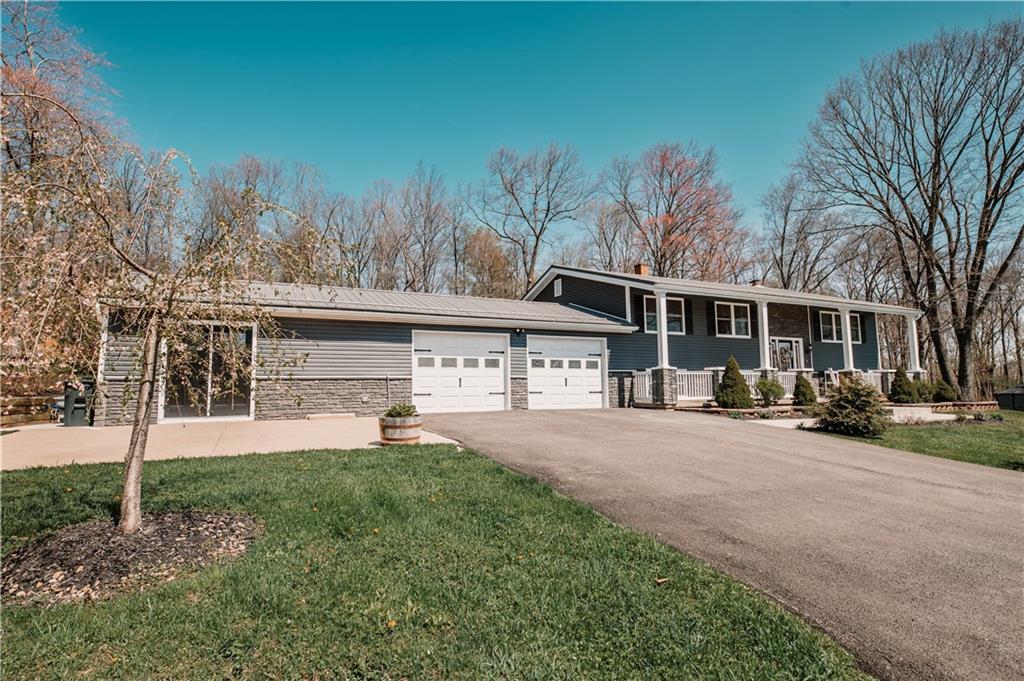 280 Chestnut Road Penn Run, PA 15765 - Photo 3 of 25 a front view of a house with a yard and trees